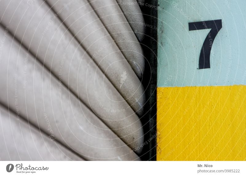 lucky number sieving 7 Rolling door Digits and numbers Detail Goal Warehouse Characters Closed Way out Entrance Part of a building Building Facade Depot