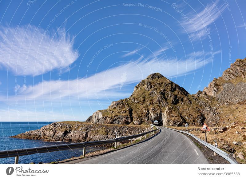 Country road with tunnel on a coastal road of Vesterålen in Norway lead Street Tunnel Ocean Vesteralen Coastal road Andøya Water mountain Rock ocean