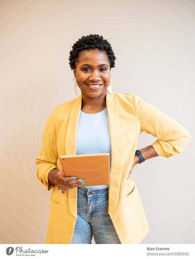 Entrepreneur Holding Tablet with Hand on Hip Technology Tablet computer tablet Fashion Black Woman headshot lifestyle blogger Computer Digital Home studio