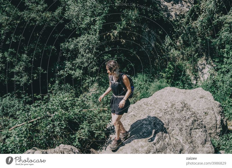 Girl walking along a small path in the mountain of Prades, Tarragona, Spain. prades catalonia spain outdoor medium copy space color people female one person 20s