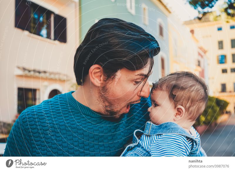 Adorable portrait of a young father hugging his baby happiness dad family love mask protect cute adorable parent parenthood single single dad childhood babyhood