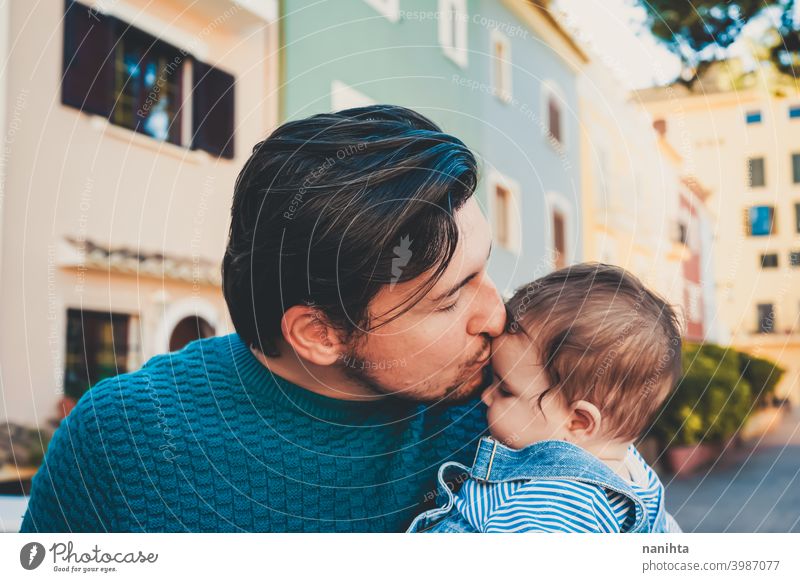 Adorable portrait of a young father hugging his baby happiness dad family love mask protect cute adorable parent parenthood single single dad childhood babyhood