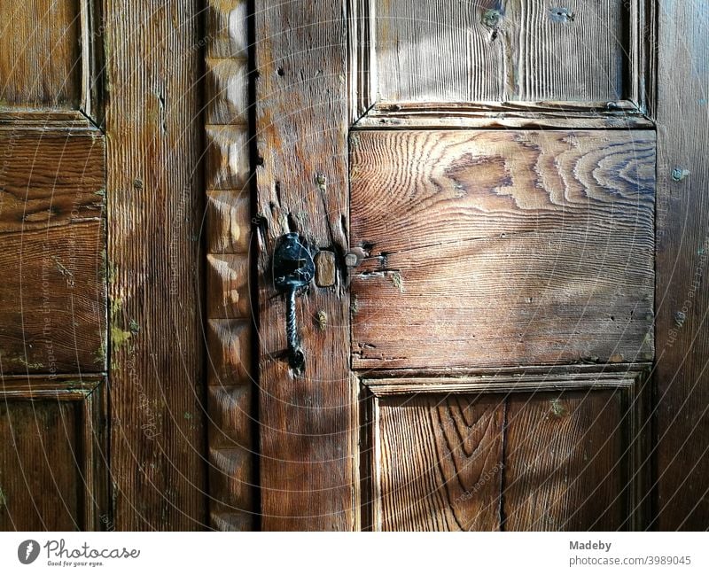 Noble wooden door of a beautiful old wardrobe in a country house in summer sunshine in Alacati near Izmir on the Aegean Sea in Turkey Cupboard Closet Wood