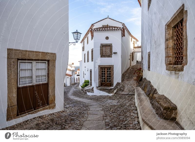 Charming street of historic Marvao, Alentejo, Portugal portugal marvao house narrow charming white sunny corner arch marvão day door cityscape unesco outdoors