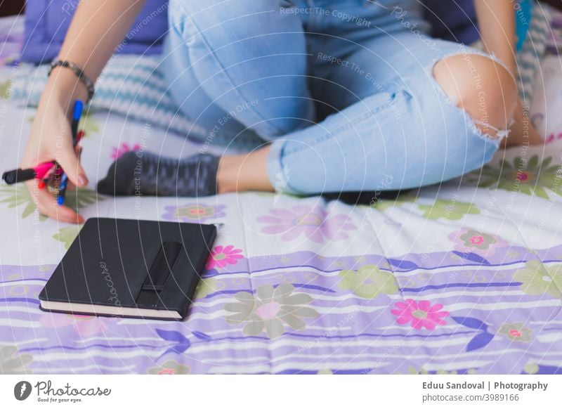 Young woman writing in her diary. office book female student letter paper men at work job notepad plan holding closeup person white page pen write hand list