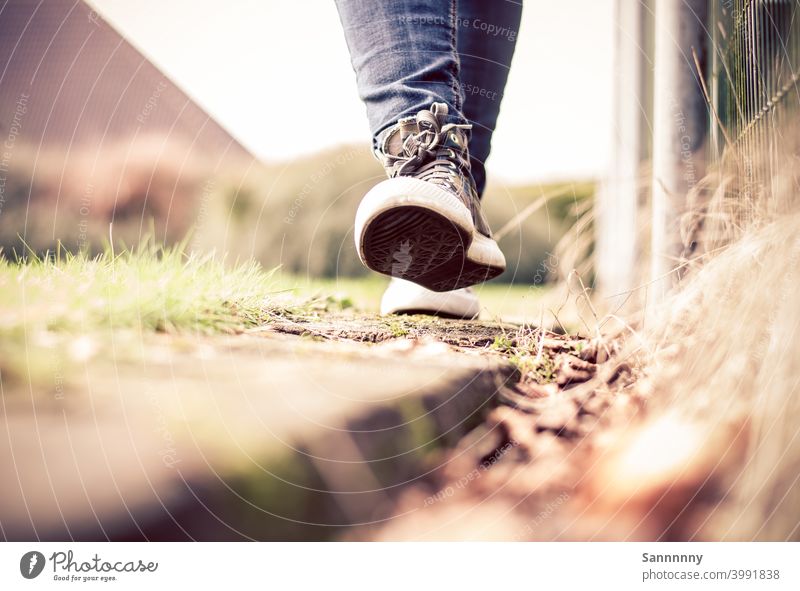 Cheerfully walking in sneakers on a railroad tie Footwear Walking Summer To go for a walk Happiness Feet Pedestrian Chucks Nature Running Ease Good mood out Hop