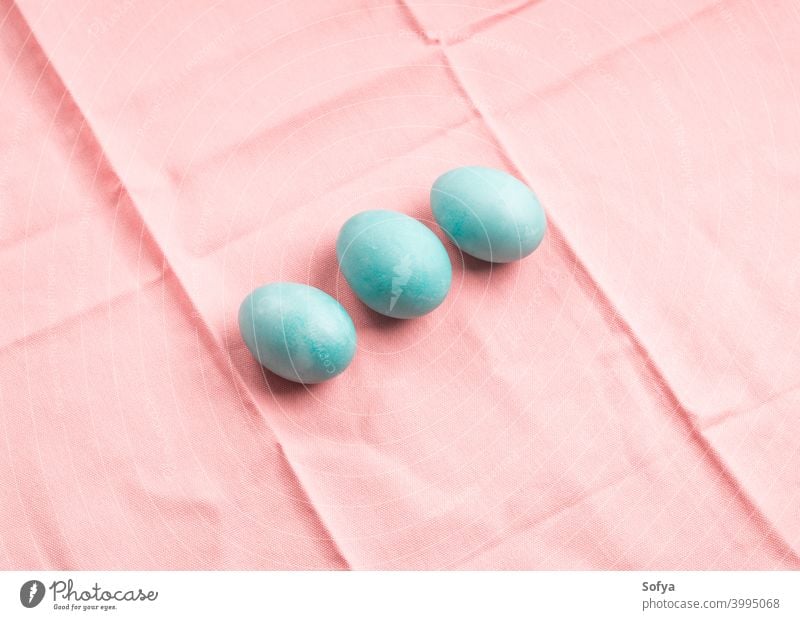 Blue easter hen eggs on pastel pink background blue spring happy napkin textile pattern april paint holiday celebration vintage color minimal food table concept