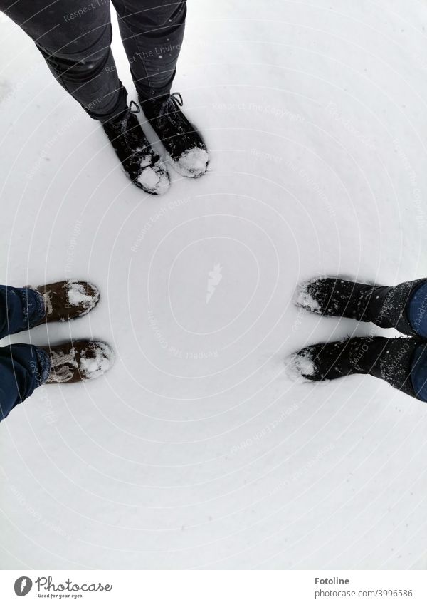 On a day in the snow 3 pairs of shoes and their owners had a lot of fun. Snow Winter Cold chill Frost closed snow cover Snow layer Ice Exterior shot White