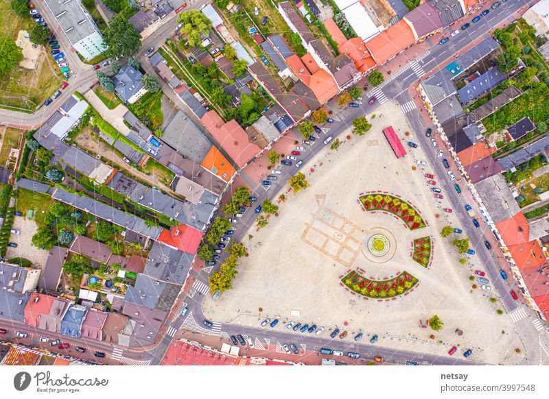 Top aerial panoramic view of Lowicz old town historical city centre with Rynek Market Square, Old Town Hall, New City Hall, colorful buildings with multicolored facade and tiled roofs, Poland