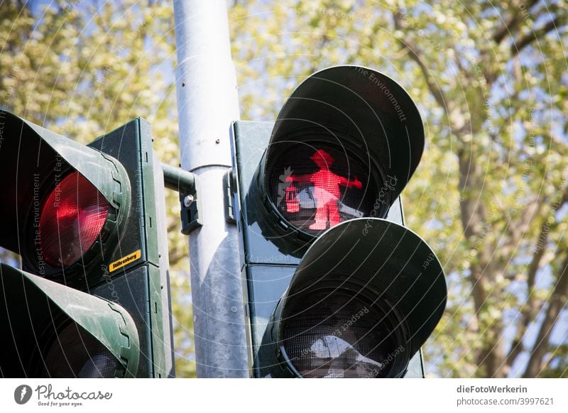 Freeze - red pit man on a traffic light Traffic light Mining colors Photography unsaturated Gray Red Colour photo Exterior shot Day Deserted Transport Road sign