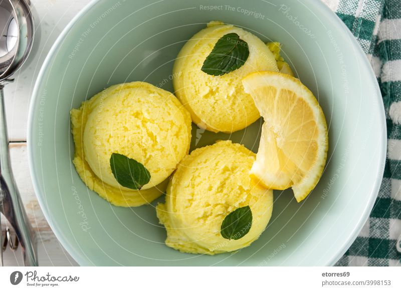 Lemon ice cream scoop decorated with mint leaves balls blue bowl cold creamy dairy delicious dessert food freeze iced lemon refreshment snack summer sweet tasty