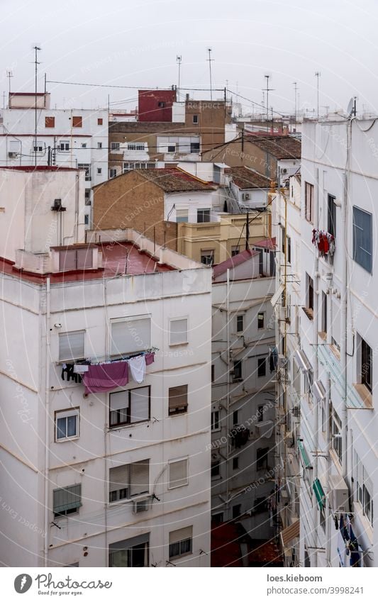 Residential apartement houses overlooking the rooftops in Valencia, Spain valencia neighborhood cityscape architecture construction white mediterranean spain