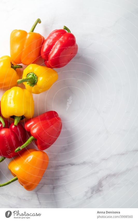 Orange, red and yellow bell peppers organic capsicum vegetable paprika orange colorful fresh healthy ingredient food freshness salad eat diet cooking nutrition