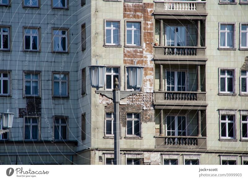 Facade Karl Marx Friedrichshain Classicism Old Balcony Street lighting Historic Authentic Past Decline Nostalgia for former East Germany Ravages of time GDR