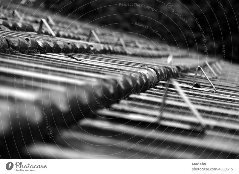 Triangles with right angles on the old tiled roof of a farmhouse on a farm in Rudersau near Rottenbuch in the district of Weilheim-Schongau in Upper Bavaria, photographed in classic black and white