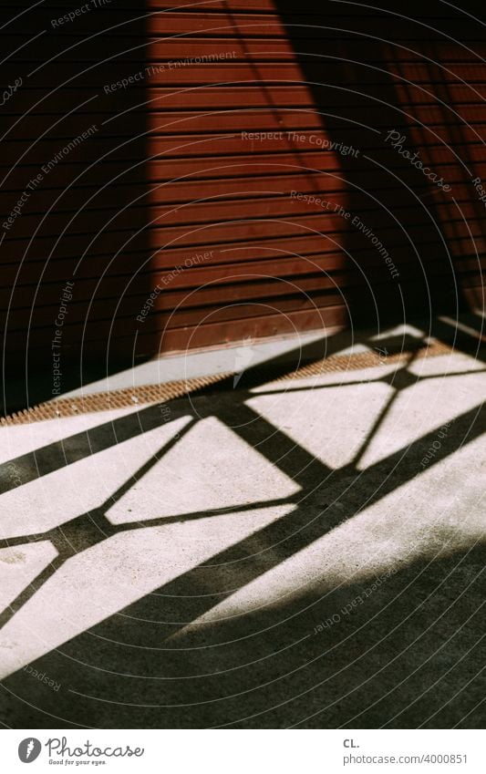 garage door Goal Garage Abstract Structures and shapes Shadow Shadow play Industrial Line Garage door Deserted Closed Exterior shot