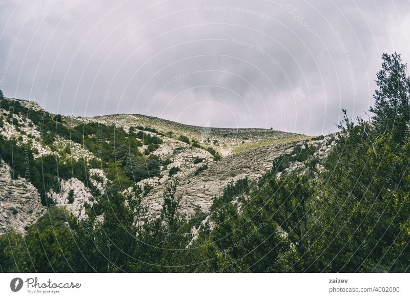 cloudy day in the mountains of the natural park of the ports, in tarragona (spain). eroded layered canyon nature outdoors travel destinations descent moment