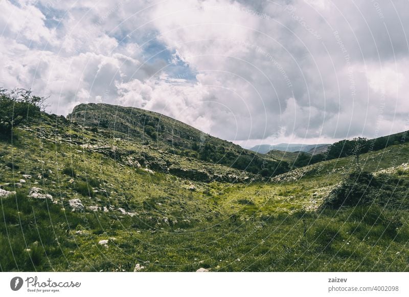 cloudy day in the mountains of the natural park of the ports, in tarragona (spain). eroded layered canyon nature outdoors travel destinations descent moment