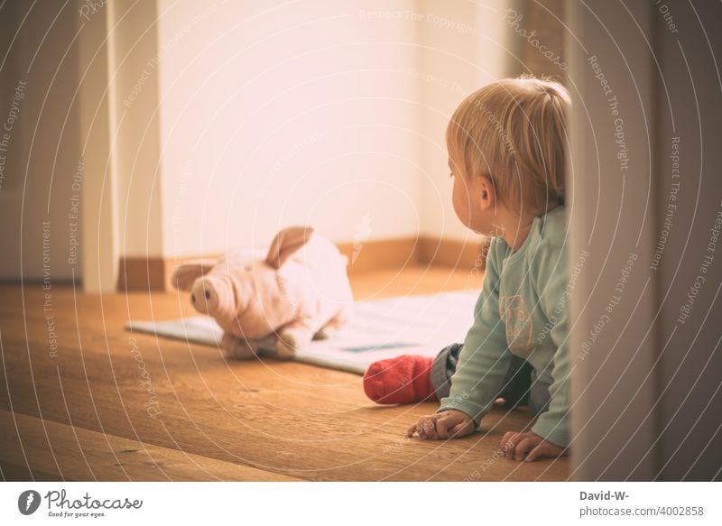 Toddler sits on the floor with his cuddly toy Infancy Sit Ground Boredom Playing Joy Child self-employment Lonely