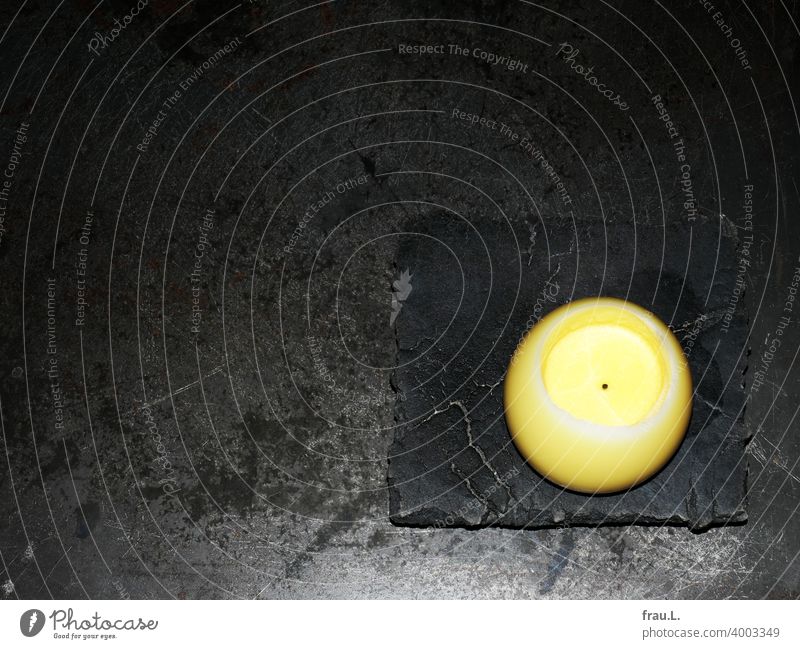 A spherical candle Table Living or residing Candle holder Yellow Metal Metal table Stone Granite Black