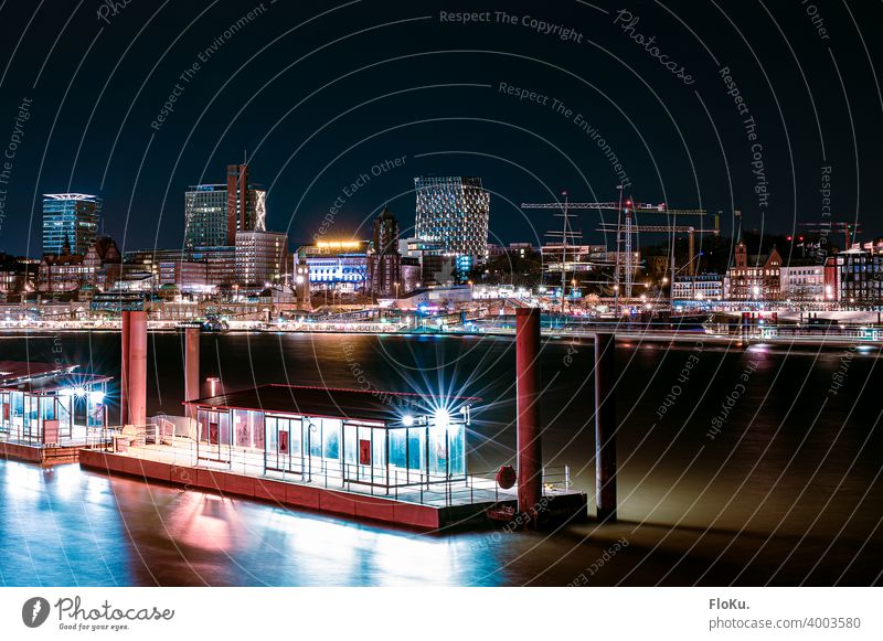 View of the St. Pauli Landungsbrücken at night Hamburg Harbour Watercraft Elbe River Navigation Port of Hamburg Port City Economy Town Blue Transport Night