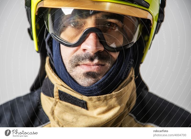 firefighter man on white background gear adult fireman service person portrait safety uniform protection yellow isolated caucasian occupation standing wearing