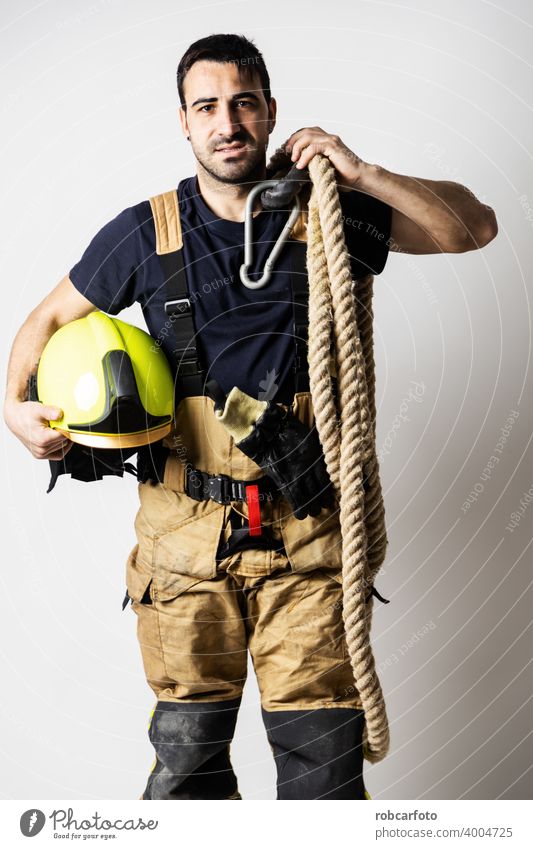 firefighter man on white background gear adult fireman service person portrait safety uniform protection yellow isolated caucasian occupation standing wearing