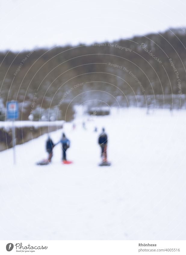 Children in village sledding blurred photo children sledging Sleigh Winter Snow Cold Nature White Sledding Joy Colour photo Exterior shot Leisure and hobbies