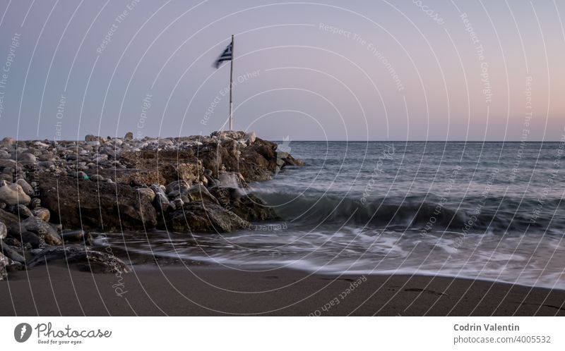 Stone breakwater at sea coast  with seashore and waves in Keratokampos, Crete architecture bay beach bird body of water building coastal and oceanic landforms