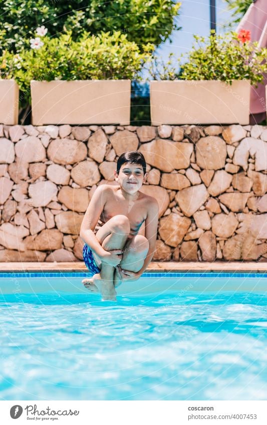 Little child jumping into a pool active activity adorable blue boy bright cheerful childhood cute energetic fun girl glasses handsome happiness happy healthy