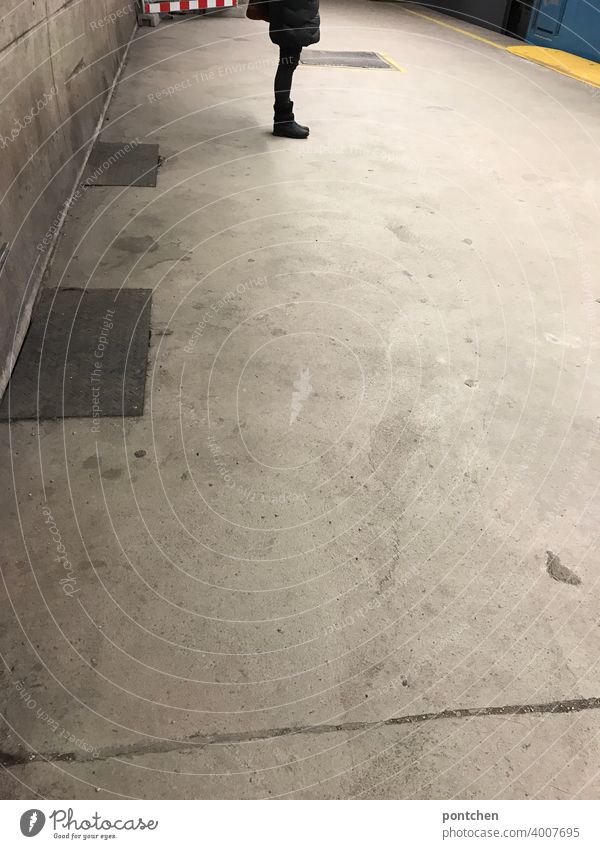 A person waits on the platform for the subway. Mobility Platform Wait public transportation garments Stand Train station Public transit Means of transport