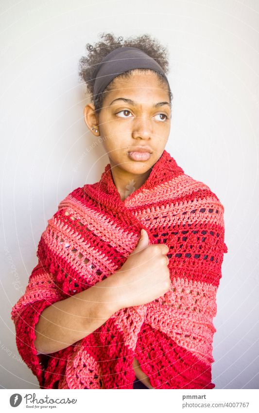 Young girl with red and pink poncho or shawl coasters gorgeous centerpiece colorful handcrafted light green knitted model brazilian smiling happy young