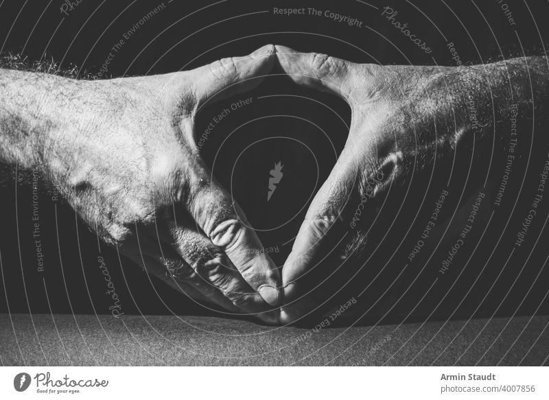 close-up of two hands showing the famous Merkel diamond adult angela black black and white bright business bw closeup contrast dark expression finger gesture