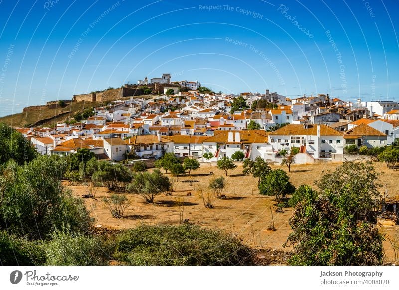 Cityscape of historic town of Estremoz, Alentejo. Portugal alentejo estremoz cityscape portugal village green copy space blue sky medieval wall houses