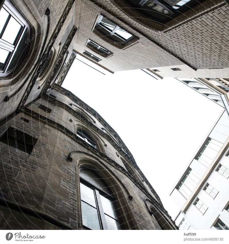 Old and new buildings form a small courtyard Interior courtyard Facade Window Worm's-eye view historical building Architecture Old town Manmade structures