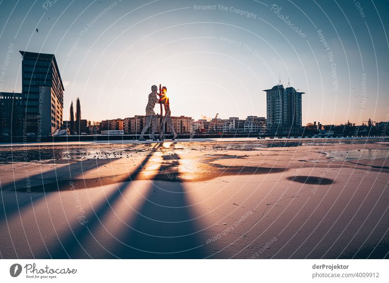 Molecule Man in winter with Spree II Wall (barrier) Wall (building) Hip & trendy Light Day Copy Space middle Exterior shot Experimental Copy Space top Berlin