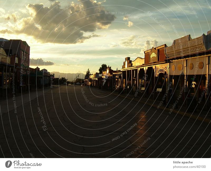 tombstone South West Western town Saloon Cowboy Native Americans Horse Horse-drawn carriage Placer Mining Sunset Dark Clouds Dusk Moody Light Red Historic USA