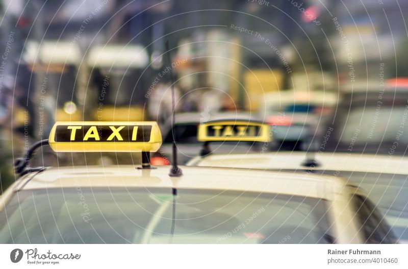 Taxis waiting for passengers at the roadside Town Transport Street Car Exterior shot Vehicle Means of transport Road traffic Traffic infrastructure Driving