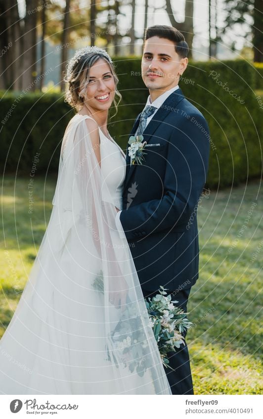 Portrait of a young couple on their wedding day marriage engagement bride people attractive copy space groom tree nature exterior sunlight summer 2 love romance