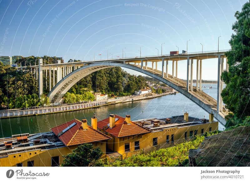 Arrabida bridge over Douro river in Porto, Portugal arrabida douro porto portugal arch arch bridge architecture arrabida bridge beautiful blue building city