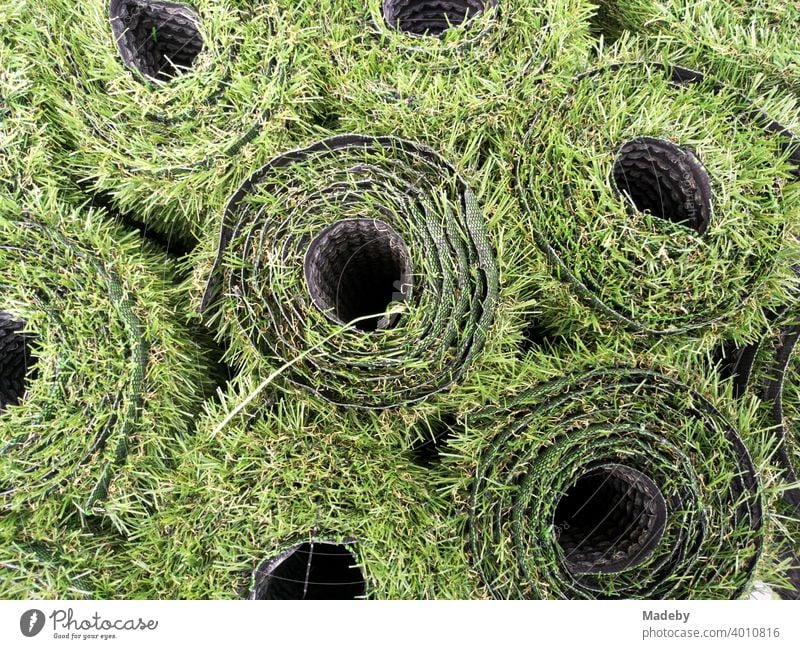 Green rolls of artificial grass for the balcony in front of a shop at Hackescher Markt in summer in the capital Berlin Lawn Artificial lawn Grass Round Coil