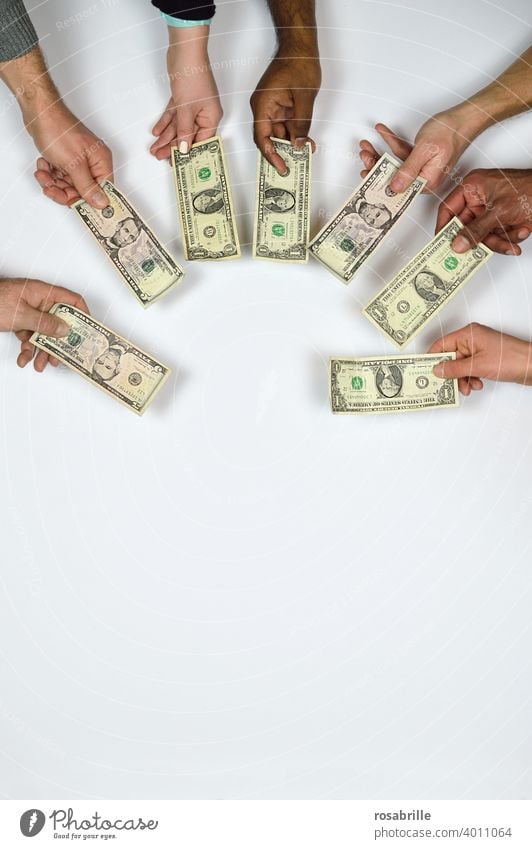 Money lenders - hands of many different people give notes in the form of dollar bills Goodness Charity Offer togetherness at the same time white background arm