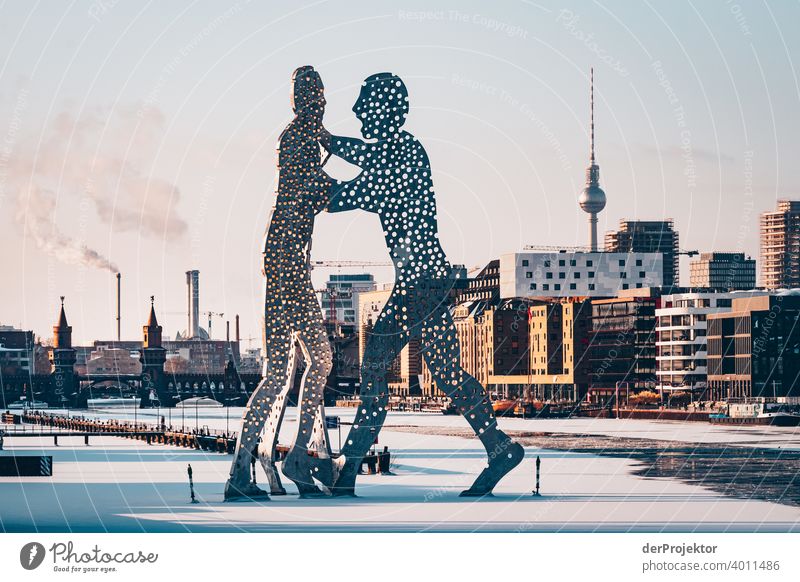 Winter view of the Spree with Molecule Man and Oberbaumbrücke and Fernsehturm I Treptow Back-light floe Esthetic Rich in contrast Shadow play Sunbeam