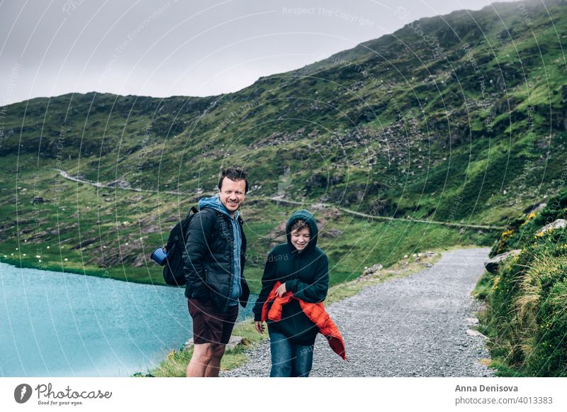 Father and daughter are enjoying staycation in Snowdonia snowdonia uk snowdonia national park track miners track rock man girl family father mount snowdon wales