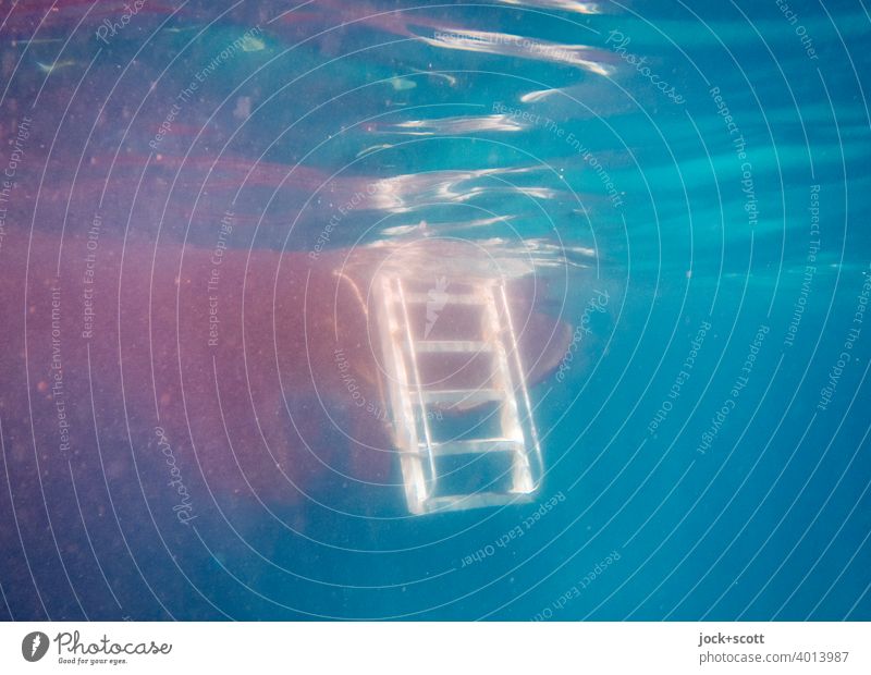 Bathing ladder for boat hangs around in the big blue swimming ladder Pacific Ocean Surface of water Underwater photo Blue Sunlight Reflection Boat Ladder