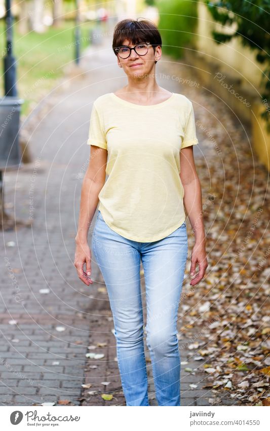 Beautiful Middle-aged woman walking down the street female outdoor mockup cute lifestyle casual caucasian cheerful care single sitting beautiful leisure summer