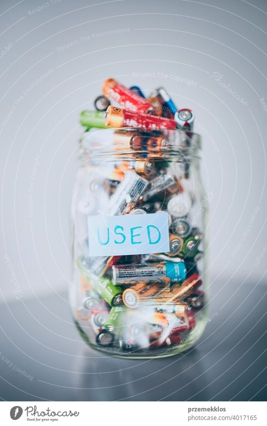 Jar filled with discharged used batteries. Waste disposal and recycling. Separating the waste battery bin collecting concept conceptual dispose ecological