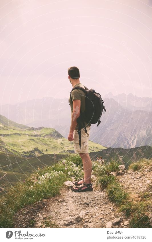 Hiking through the mountains - man enjoys the view of the wonderful panorama vacation hikers Mountain Lanes & trails Vantage point alpine panorama Vacation mood