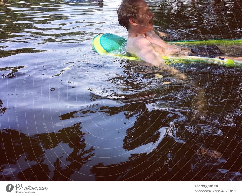 Left side of the water. Man Water Pond bathe Summer rubber boat Swimming & Bathing Lake cooling Wet Nature Human being Exterior shot Colour photo Day