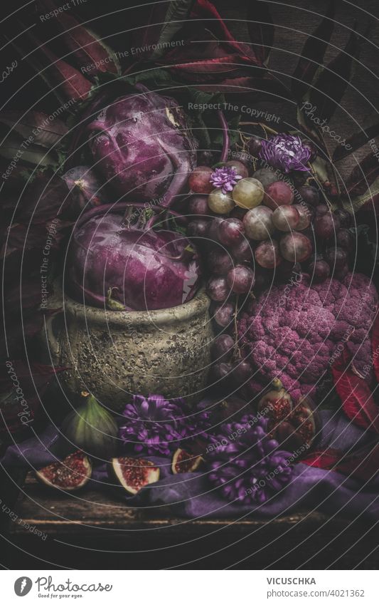 Still life with purple fruits and vegetables. Dark still life dark rustic ingredient nutrition vegetarian natural diet raw organic background fresh healthy food